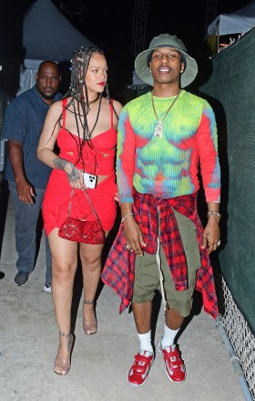 Bridgetown, BARBADOS - *EXCLUSIVE* - Rihanna looks sizzling as she steps out with boyfriend A$AP Rocky for a fun night out at the Imagine reggae show while vacationing in Barbados.The two made a bold impression when ASAP complimented Rihanna's flirty red dress with a thermal-inspired shirt and detailed red pieces to complete her coordinated look. two lovebirds stayed close to each other as they interacted with the public Pictured: Rihanna, A$AP Rocky BACKGRID USA NOVEMBER 28, 2022 BYLINE MUST READ: @246PAPS / BACKGRID USA: +1 310 798 9111 / usasales @backgrid.com UK: +44 208 344 2007 / uksales@backgrid.com *UK Customers - Images containing children, please pixelate face before posting* 